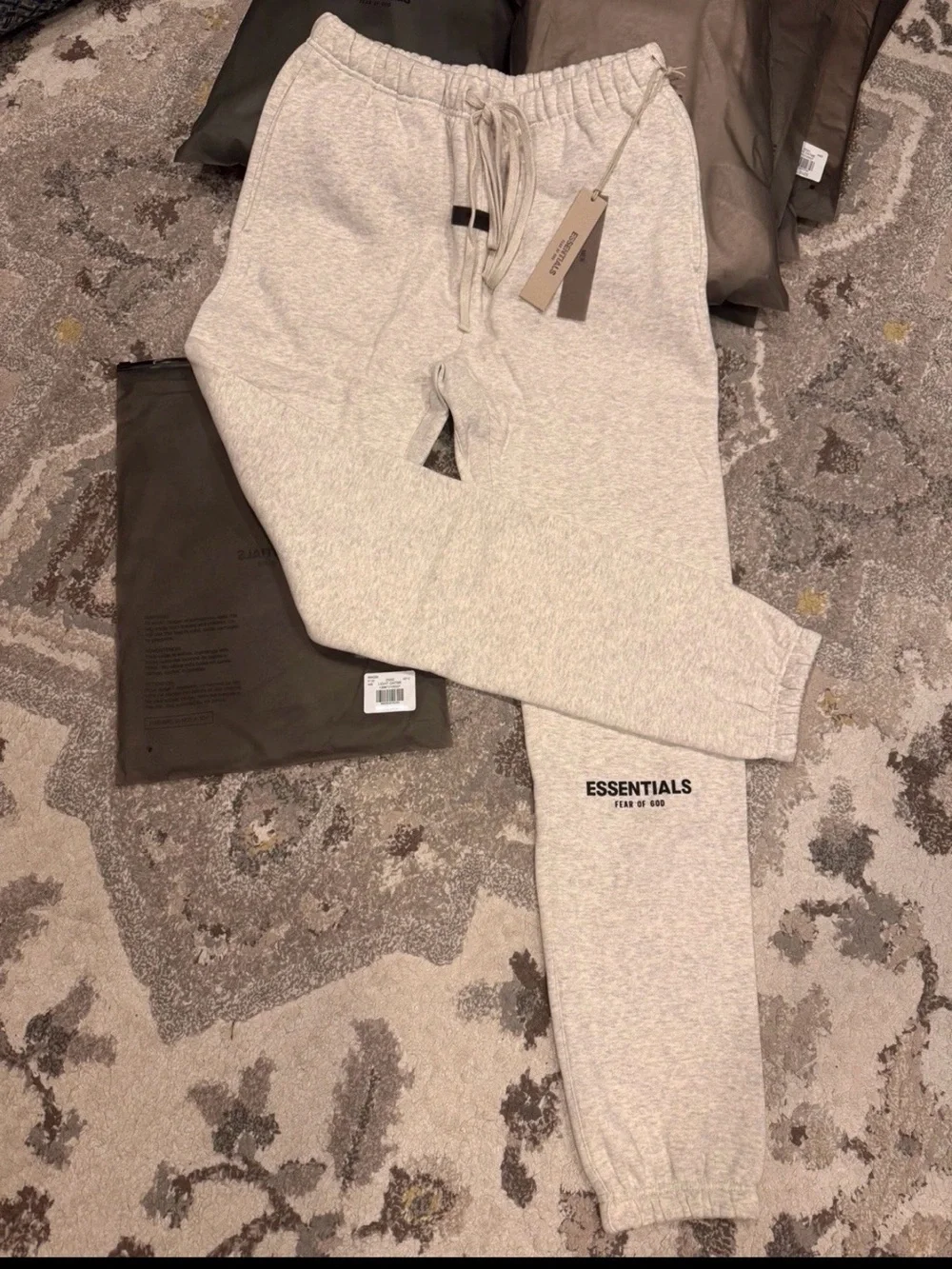 Brand new Essentials light oatmeal cuffed sweatpants with tags and original bag